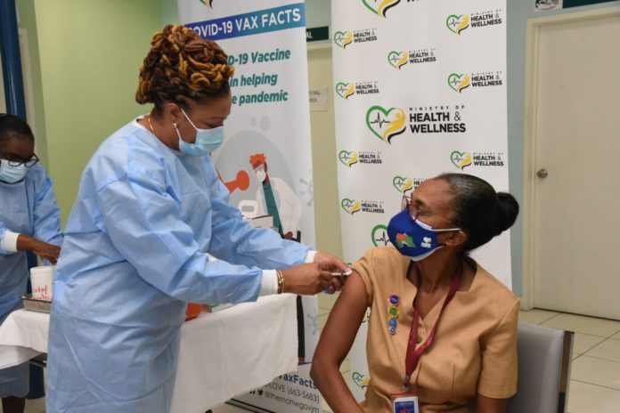 Public Health Nurse Marcia Thomas-Yetman receives the first coronavirus (COVID-19) vaccine given in Jamaica at The Good Samaritan’s Inn in Kingston.