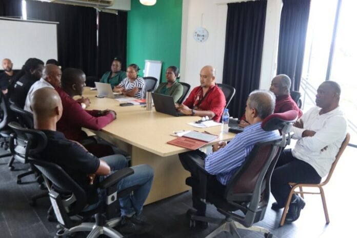 Gold mining site in Suriname with workers and machinery