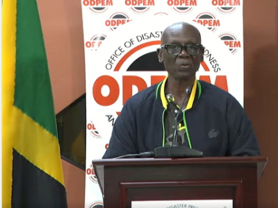 Jamaica-3 Jamaican officials surveying hurricane damage in affected community