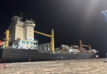 St. Vincent opens new Kingstown Port. Newly constructed Kingstown Port in St. Vincent with container ships and ceremony attendees