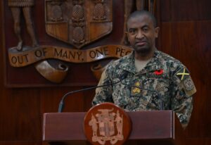 Jamaican police and military personnel preparing emergency vehicles for hurricane response