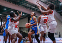 BASKETBALL-Virgin Islands Women roll over Suriname to remain unbeaten. U.S. Virgin Islands women's basketball team player driving to the hoop against Suriname.