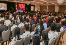 ST. KITTS-St. Kitts and Nevis are predicting steady economic growth in 2025 and beyond. St. Kitts and Nevis government officials reviewing economic forecast charts