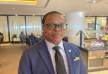 TRINIDAD-Man charged after threatening to kill opposition legislator. Trinidad police escorting accused man from courthouse after hearing