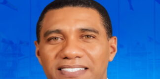 CARIBBEAN-Outgoing CARICOM chair reiterates the need for the Region to be a zone of peace. Outgoing CARICOM chairman at podium addressing regional peace.