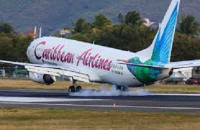 Caribbean Airlines Discontinue Caribbean Flights Caribbean Airlines aircraft on tarmac with route map changes displayed