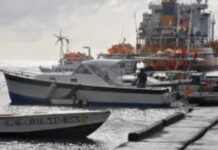 GRENADA-Fishermen face a maximum EC$100,000 fine under new fisheries regulations. Grenada fisheries officials explaining new regulations to fishermen.