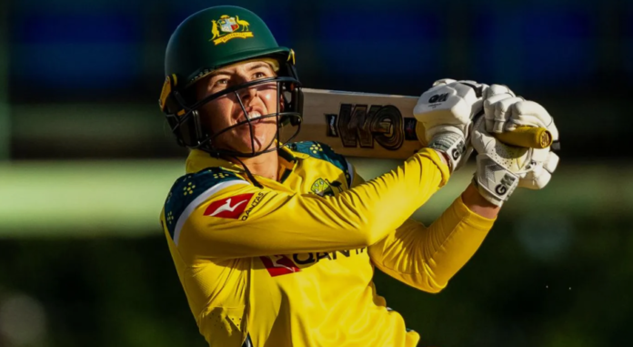 Australia's Georgia Wareham celebrates taking a wicket with teammates during the 2nd WODI at Warner Park in St Kitts on March 29, 2026, where she claimed 3 for 29 and scored 39 runs to lead Australia to a 90-run victory over West Indies