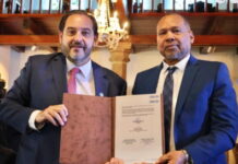 BELIZE-Government reiterates support for OLACDE and endorses re-election of executive secretary. Dr Leroy Almendarez CEO of Belize Ministry of Public Utilities addresses OLACDE leadership transition ceremony endorsing re-election of Executive Secretary Andrés Rebolledo Smitmans for 2026-2029 term