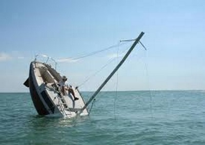 boat-sinking Guyana Police and Coast Guard investigators at Ruimveldt Maritime Police Wharf examine the recovered body of 21-year-old seaman Ravindra Bissoondyal who died after molasses barge TRADER III sank off Buxton East Coast Demerara between March 9 and 11 2026