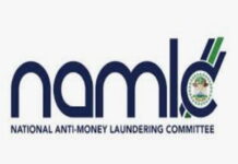 SURINAME-NAMLAC warns Suriname could be blocked over failure to implement AML/CFT/CPF measures. NAMLAC official speaking at press conference about Suriname compliance warning