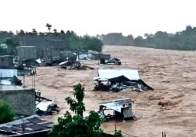 floods-haiti-april Rescue workers navigating flooded streets in Northwest Haiti after deadly floods