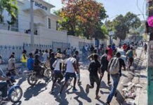 HAITI-IACHR is concerned about the escalating violence in Haiti. IACHR logo with Haiti flag and rising violence graph in background