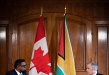 GUYANA-Canada, Guyana leaders emphasize ‘strong’ ties. Canadian and Guyanese leaders shaking hands at bilateral meeting