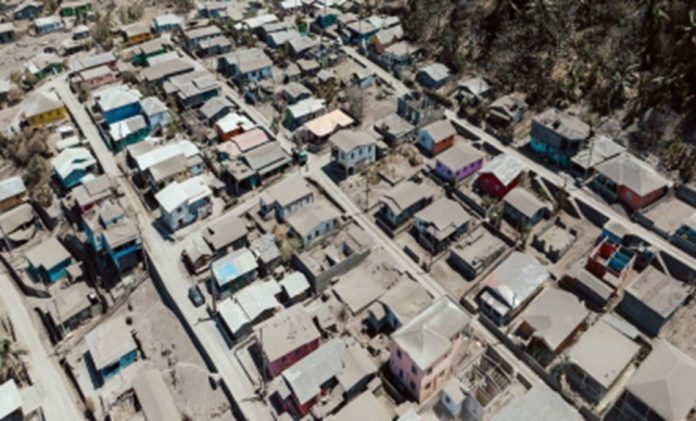 Ash-from-the-eruptions-of-the-La-Soufriere-volcano-covers-a-town-in-St-Vincent-and-the-Grenadines.-File-Photo-696x421