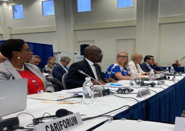 CARIFORUM_Chair_E.P_Chet_Greene_addressing_the_EU-CARIFORUM_Ministerial_meeting_as_EU_Commissioner_for_International_Partnerships_Jutta_Urpilainen_looks_on_CMC_Photo