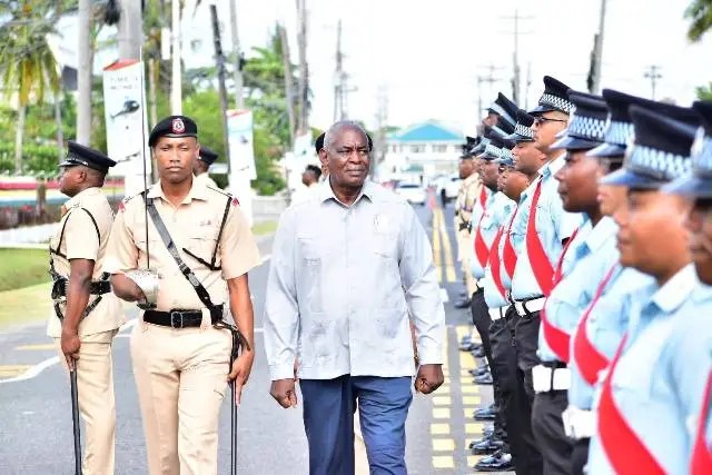 Minister-of-Home-Affairs-Robeson-Benn-inspects-police-officers-during-the-opening-of-the-conference