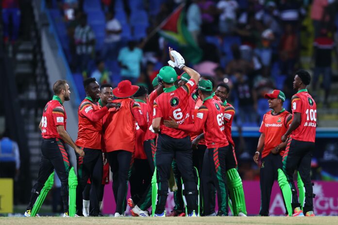 Guyana Amazon Warriors team celebrates a wicket during CPL match