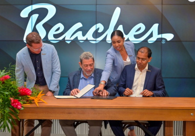 Gonsalves-signing-beaches Sandals Resorts to begin designing a new luxury resort in St. Vincent next year