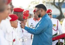 GUYANA-President confers GDF ranks with military medals. President of Guyana presenting military medals to Guyana Defence Force officers at ceremony