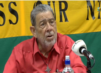 Ralph-Gonsalves-on-publication Prime Minister Ralph Gonsalves holding his new book about Fidel and Raúl Castro