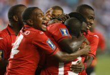 FOOTBALL-UNITED IN BELIEF: T&T stalwarts rally behind national football team for World Cup push Trinidad and Tobago national football team players huddle together during World Cup qualifying preparations.