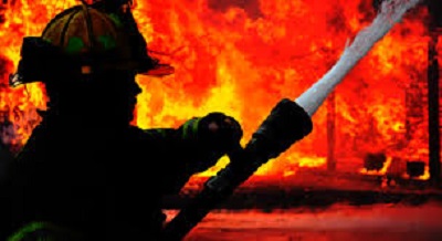 Mother and Son Killed in Suspected Arson Attack in Belize Forensic investigators at the scene of a fatal house fire in Belize.