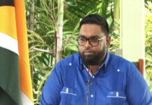 GUYANA-Government to provide support packages to citizens. Guyanese government officials distributing support packages to citizens