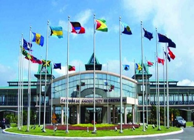 CARICOM-Flags CARICOM leaders gathered at summit discussing regional finances.