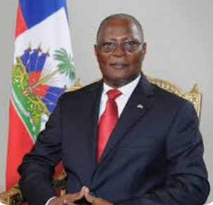 Jocelerme-Privert- Former Haitian President speaking at press conference on constitutional legitimacy.