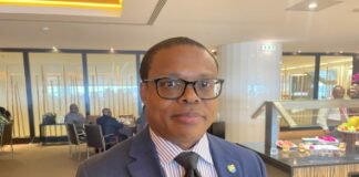 TRINIDAD-Man charged after threatening to kill opposition legislator. Trinidad police escorting accused man from courthouse after hearing