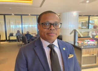 TRINIDAD-Man charged after threatening to kill opposition legislator. Trinidad police escorting accused man from courthouse after hearing