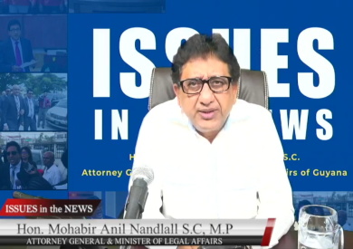 Anil-Landlal-Issues-in-the-news Guyana government officials presenting electronic identification legislation document.