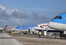 Barbados Airport records peak winter travel day with nearly 10,000 passengers. Barbados airport terminal bustling with winter holiday passengers.