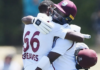CRICKET-LEAD Heroics by Greaves, Roach earn Windies historic draw against Kiwis. West Indies cricketers Justin Greaves and Kemar Roach celebrating Test match draw.