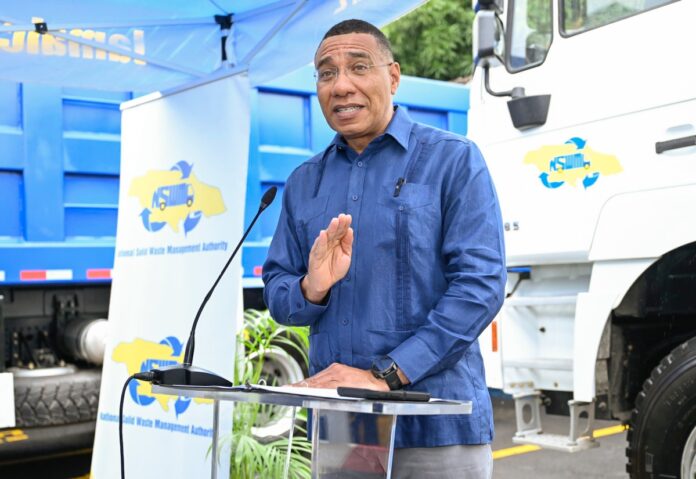 Jamaican PM and officials inspect new tipper trucks donated by China