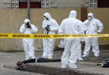 TRINIDAD-Gunmen storm home, killing two people, including a 14-year-old.