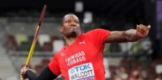 ATHLETICS-Bertrand, Walcott crowned athletes of the year at NAAATT awards. Dylan Bertrand and Tyriq Walcott hold trophies at NAAATT awards ceremony