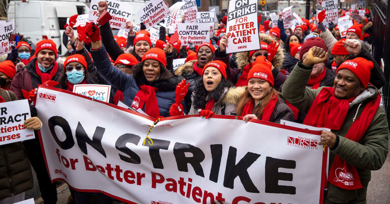 UNITED STATES-Caribbean legislators stand with striking nurses.
