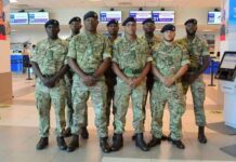 JAMAICA-Eight man contingent from Cayman Islands assisting in humanitarian relief. Eight-member Cayman Islands Regiment contingent in uniform departs for Jamaica humanitarian relief mission to repair roofs in St Elizabeth following Hurricane Melissa devastation