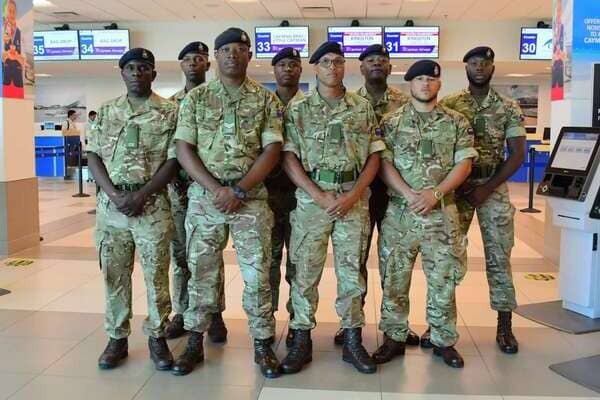 Cayman Islands Regiment deploys eight troops to Jamaica for hurricane relief February 2026 Eight-member Cayman Islands Regiment contingent in uniform departs for Jamaica humanitarian relief mission to repair roofs in St Elizabeth following Hurricane Melissa devastation
