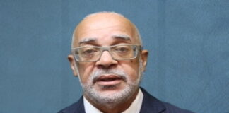 CMCFeature-No One Is Coming to Save Us – Which Is Why We Must Build Ourselves. Caribbean people working together in community development project illustrating CMC Feature theme that No One Is Coming to Save Us and the region must build itself through self-reliance and unity