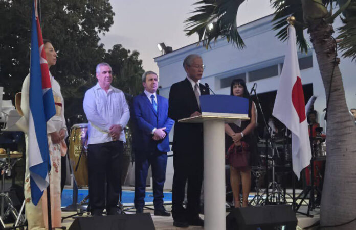 Japanese Ambassador to Cuba Nakamura Kazuhito and Cuban Deputy Prime Minister Eduardo Martínez greet each other at National Day reception in Havana reaffirming bond of friendship and cooperation between Japan and Cuba