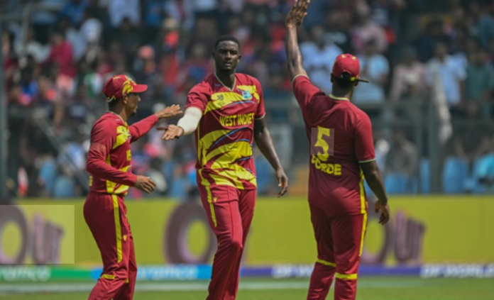 Jason-Holder-grabs-four West Indies all-rounder Jason Holder celebrates taking a wicket during Player of the Match performance of 4-27 against Nepal at ICC T20 World Cup 2026 in Mumbai