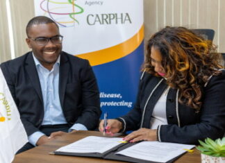 CARIBBEAN-PAHO and CARPHA sign framework agreement. AHO Director Dr. Jarbas Barbosa and CARPHA Executive Director Dr. Lisa Indar sign framework agreement virtually