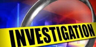 JAMAICA-Police probe drug smuggling attempts at courier companies. Jamaican police officers at FedEx building in Half-Way Tree during operation seizing one kilogram of cocaine destined for Canada