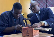 JAMAICA-St. Lucia, the education minister, tours a special needs education school in Jamaica. St. Lucia Education Minister Danny Butcher tours the woodwork shop at Windsor School of Special Education in St. Andrew, Jamaica, on March 18, 2026, observing students' vocational training and handmade wooden gift boxes