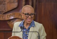 JAMAICA–Jamaica prepared for oil price fluctuations amid the Middle East conflict. Jamaica Finance Minister Fayval Williams delivers the 2026-2027 Budget Debate presentation at Gordon House in Kingston, assuring the nation that strong US$6.8 billion Net International Reserves will buffer Jamaica against oil price fluctuations amid the Middle East war