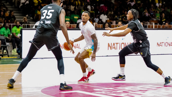 Franco-Miller Bahamas basketball player Travis Miller celebrates after scoring during opening match of FIBA Men's Centrobasket Championship against Jamaica at Barbados Community College on March 2 2026