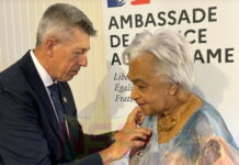 SURINAME-Suriname national gets France’s highest award. French Ambassador Nicolas de Lacoste pins the Legion of Honour medal on Surinamese writer Cynthia Mc Leod-Ferrier at the French Residence ceremony as family and friends attend on March 2 2026